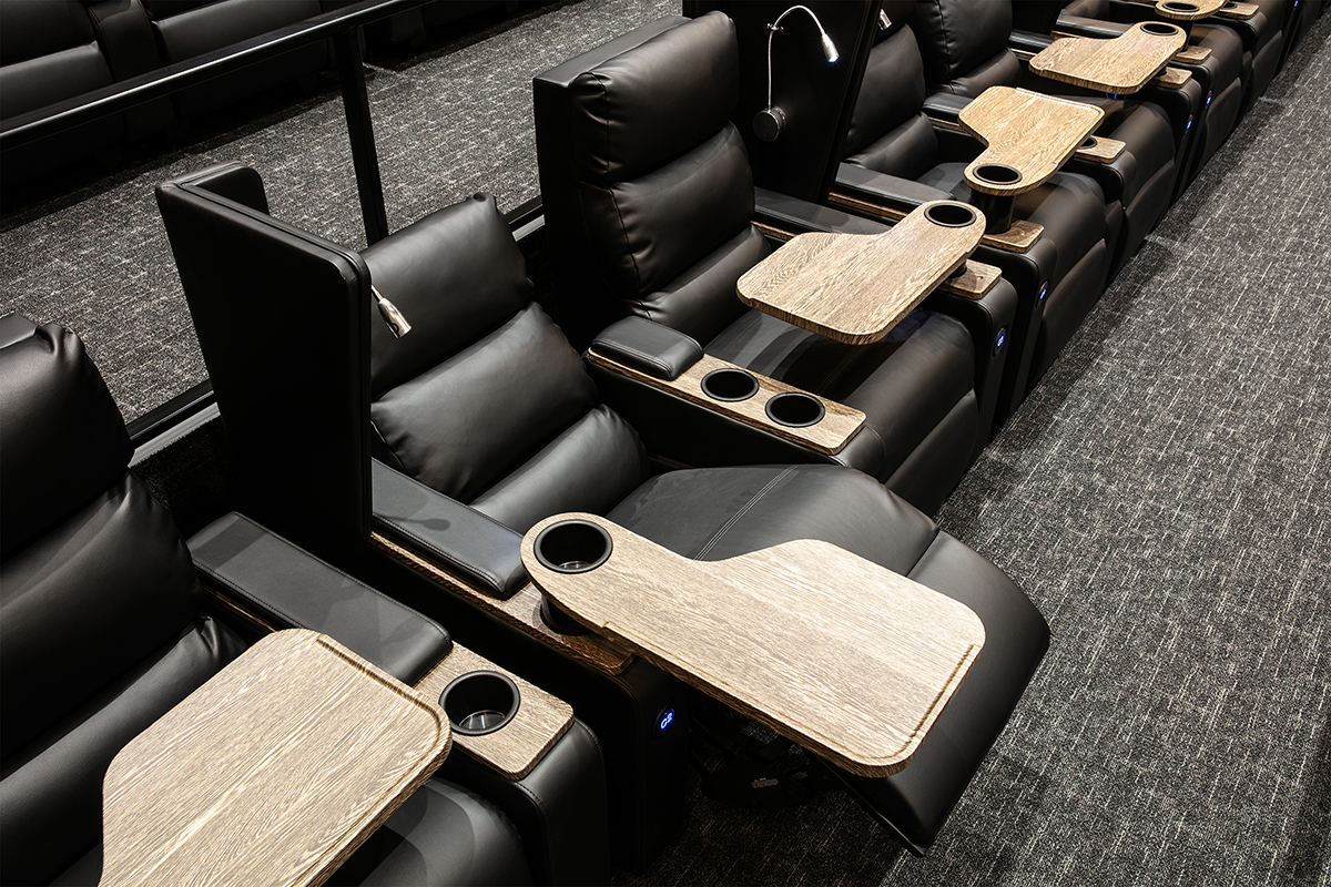 Showing a fully reclined dine-in cinema seat at the CMX Cinebistro at Tyson's Corner.