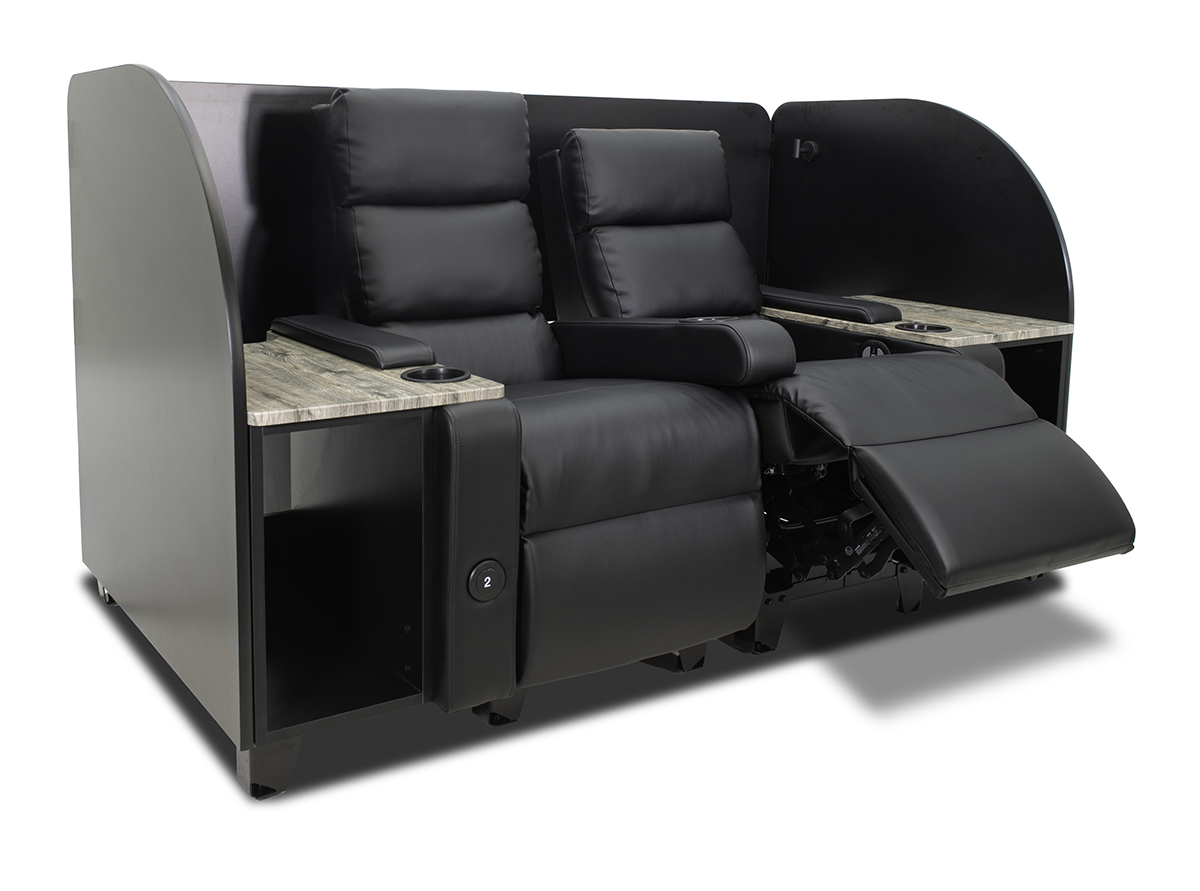 A black, privacy pod recliner cinema seating booth. 
