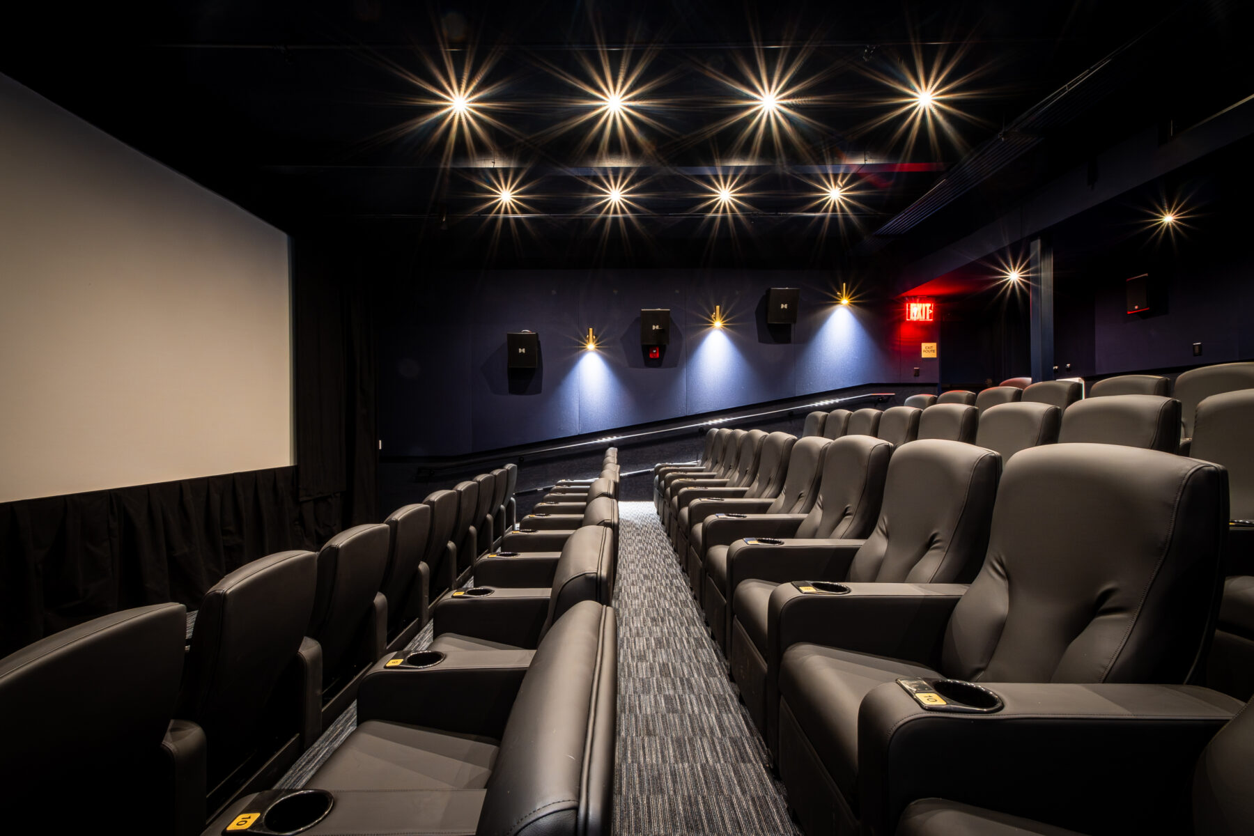 Looking at a row of Irwin Seating modern Luna cinema rockers installed by ES&T.