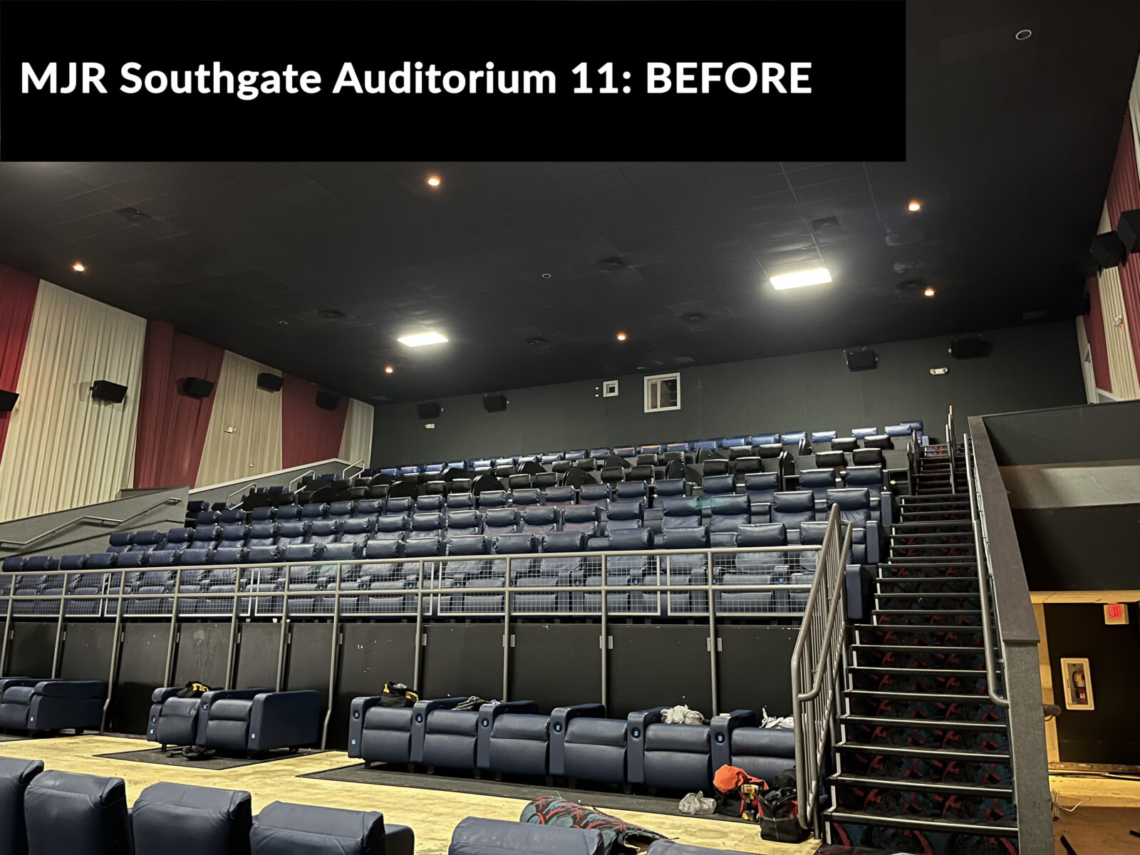 MJR Southgate IMAX auditorium before renovations with old seating and red and yellow wall draperies.