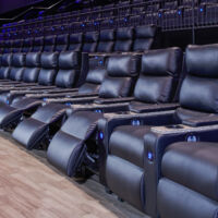 MJR Troy IMAX auditorium in Troy, Michigan view of the auditorium looking down a row of Irwin Spectrum recliners installed in the auditorium.