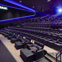 MJR Troy IMAX auditorium in Troy, Michigan view of the auditorium looking from the side at seating and projection booth.